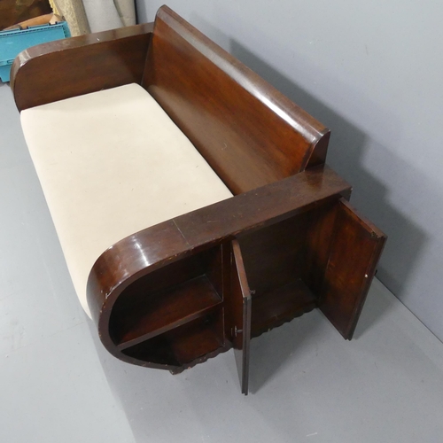 2335 - A French Colonial Art Deco sofa, the armrests with built in cupboards and book shelves. Overall 165x... 