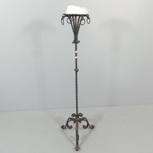 2338 - An antique wrought iron candle stick stand. H - 132cm.