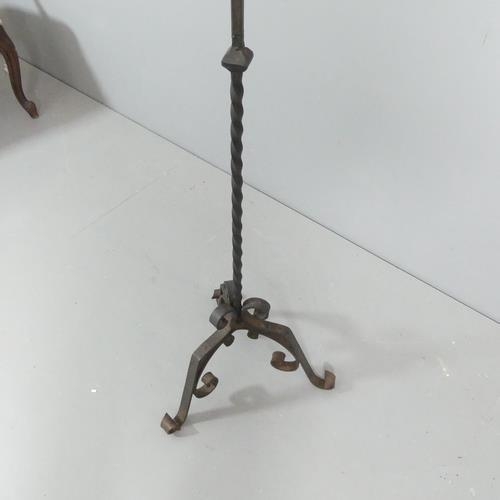 2338 - An antique wrought iron candle stick stand. H - 132cm.