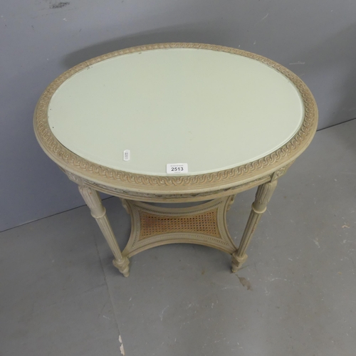 2513 - A modern French painted oak oval two-tier side table, with inset glass top, carved decoration and ca... 