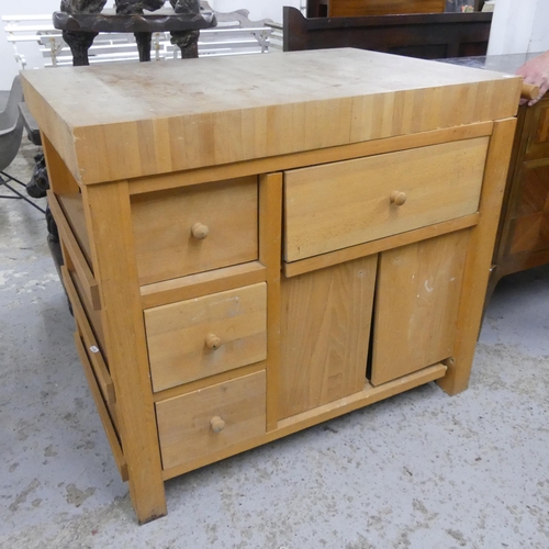 2514 - A modern light oak butchers block, the base fitted with four drawers, two cupboard doors, end rail a... 