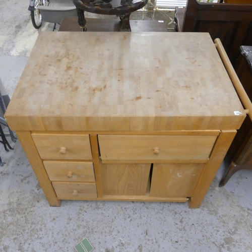 2514 - A modern light oak butchers block, the base fitted with four drawers, two cupboard doors, end rail a... 