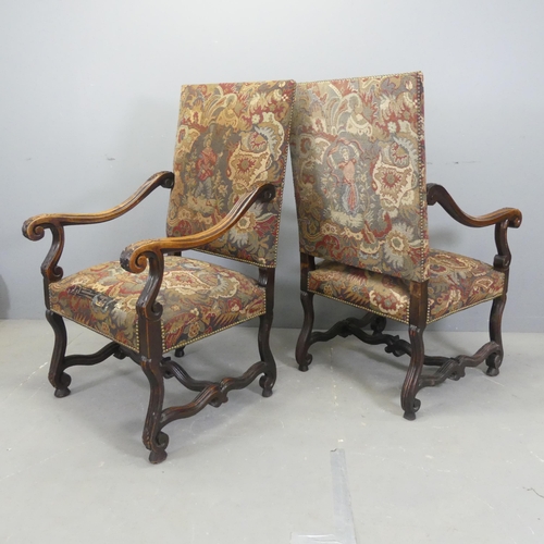 2522 - A pair of French oak and needlepoint upholstered open arm chairs.