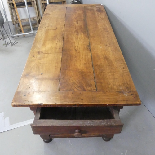 2524 - A French Cherrywood plank-top dining table, with two end-frieze drawers, turned legs and H-shaped st... 