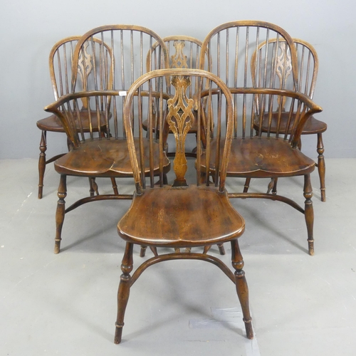 2525 - A set of six elm-seated dining chairs with crinoline stretchers. (4+2)