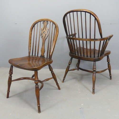 2525 - A set of six elm-seated dining chairs with crinoline stretchers. (4+2)