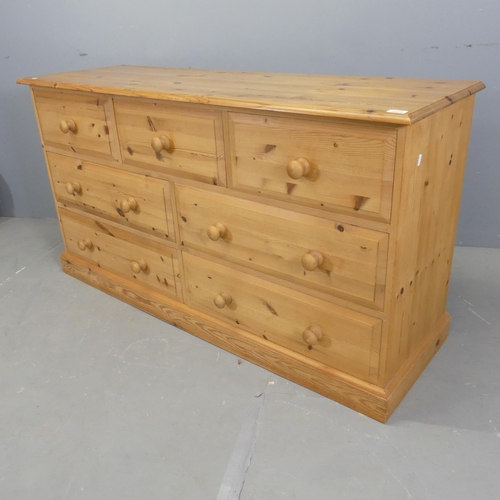 2533 - A modern pine chest of three short and four long drawers. 150x81x50cm.