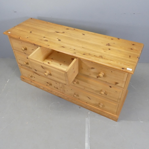 2533 - A modern pine chest of three short and four long drawers. 150x81x50cm.