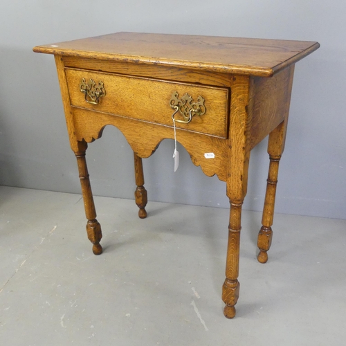 2534 - An 18th century style oak side table, with single drawer and turned legs. 66x72x36cm.