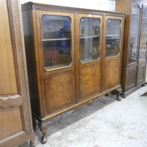 2544 - A Queen Anne style mahogany bookcase, with three glazed panelled doors, applied carved decoration an... 