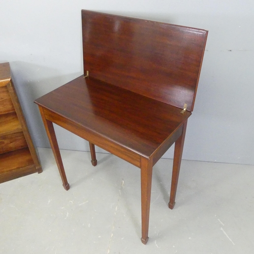 2547 - An Edwardian mahogany folding tea table, 69x72x35cm, a small bookcase and a rush seated chair, impre... 