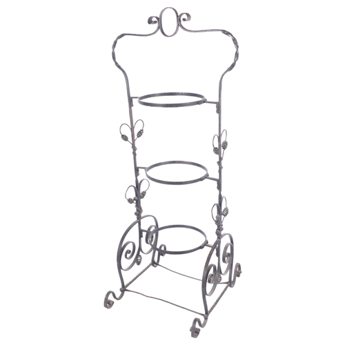 675 - A wrought-iron 3-tier cake stand, lacking plates, H79cm