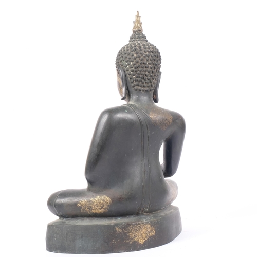 11 - A large cast-bronze figure of a seated Buddha, with gilded highlights, H63cm