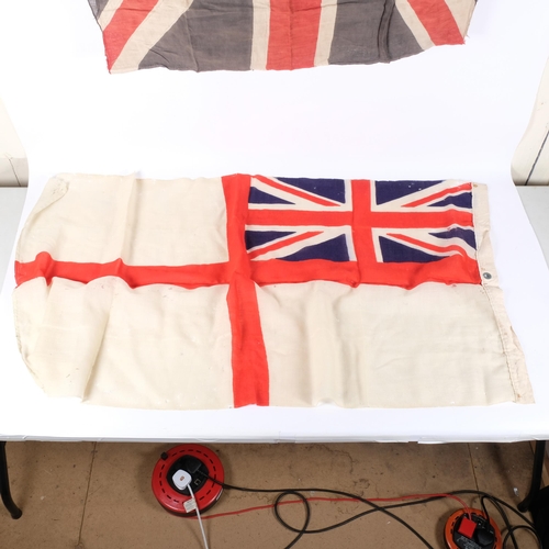 115 - A Royal Navy white ensign, 67cm x 135cm, and a 20th century Union Jack, 82cm x 112cm approx (2)