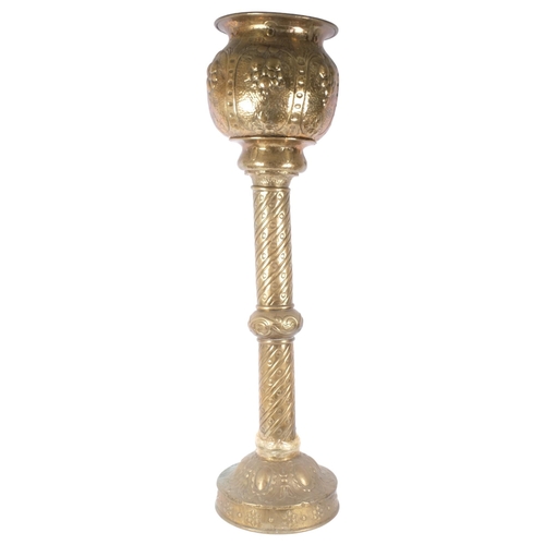 129 - A Victorian embossed copper jardiniere on stand, H127cm