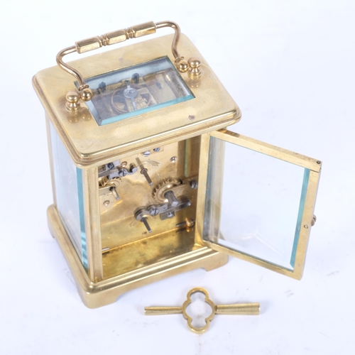 131 - A French brass-cased carriage clock with alarm, height 11cm not including handle, white enamel dial ... 