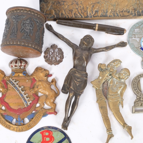 138 - A group of various items, including a bronze Corpus Christi, safe plaque, brass oil lamp, erotic bra... 