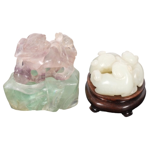 140 - A small Chinese carved jade netsuke, depicting 3 cats on a carved wooden stand, diameter 40mm, and a... 