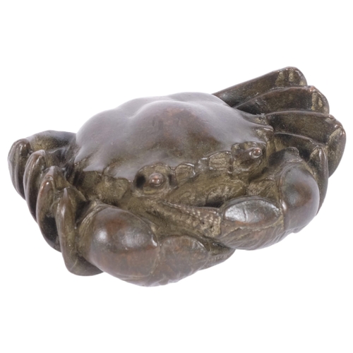 146 - A small cast-bronze crab