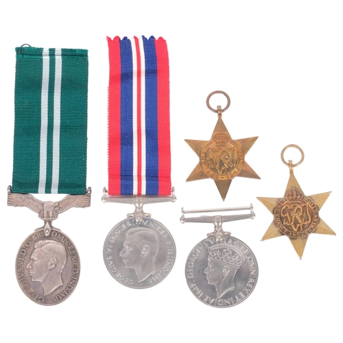 149 - A group of Second World War medals and ribbons, including Air Efficiency, with original box