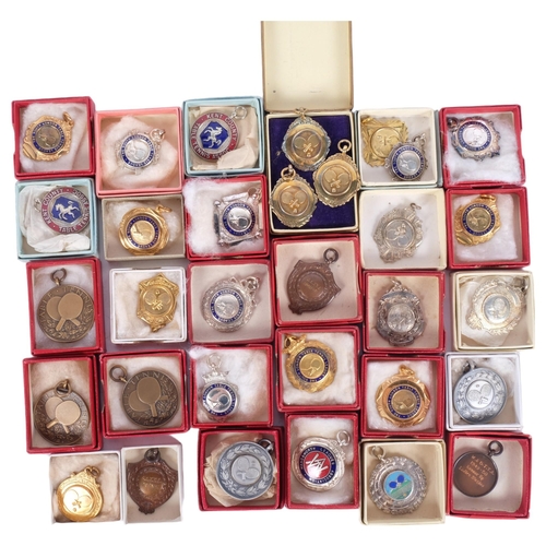 151 - A large group of table tennis medals, including silver and enamel