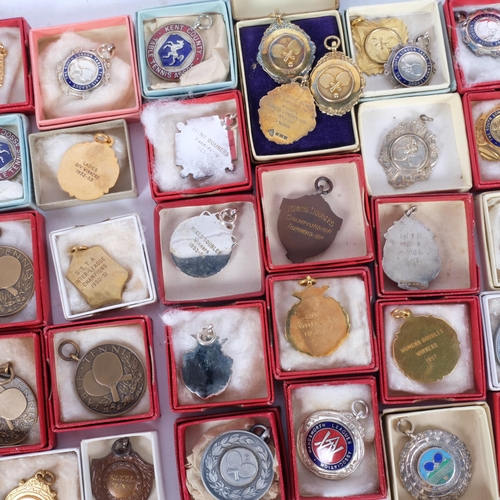 151 - A large group of table tennis medals, including silver and enamel