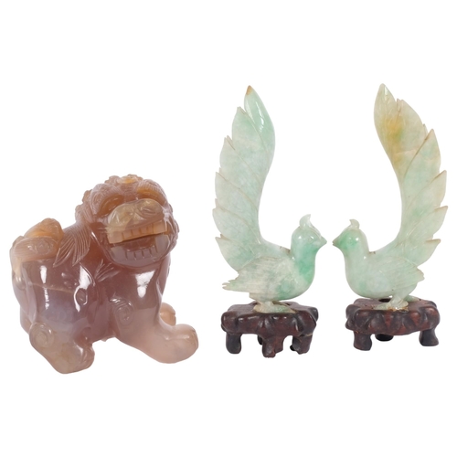 159 - A pair of Chinese carved jadeite birds on stands, and a quartz dog of fo (3)