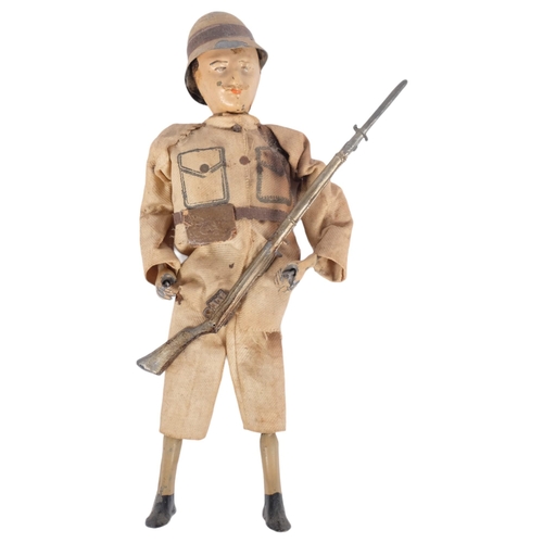 162 - A Victorian (Boer War?)  painted metal clock work soldier, complete with rifle, H20cm