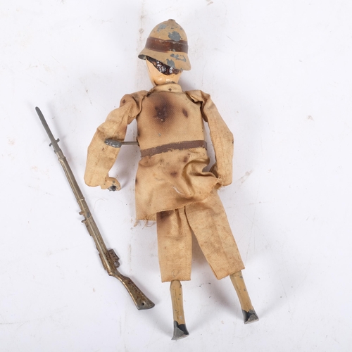 162 - A Victorian (Boer War?)  painted metal clock work soldier, complete with rifle, H20cm