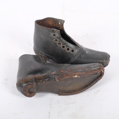 163 - A pair of small Georgian leather boots, with studded edge and steel bands to soles, overall length 1... 