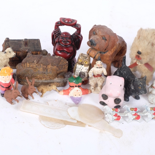 174 - A box of various items, including a carved small West German Plush dog, various other miniature orna... 