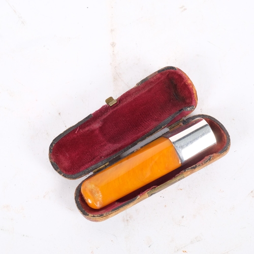 176 - A silver and amber cigar holder in fitted case