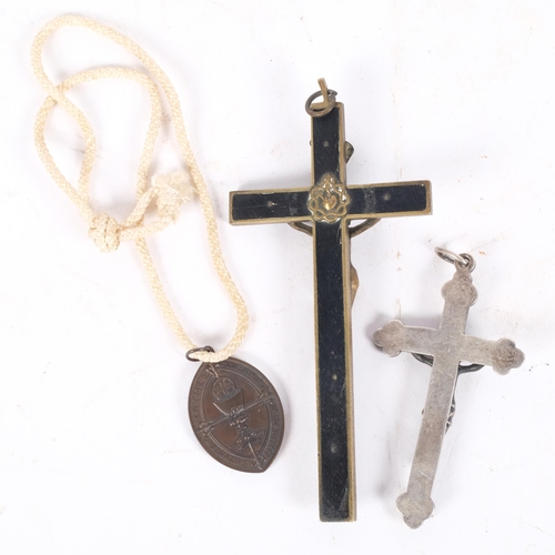 184 - An English silver hallmarked crucifix, L10cm, an ebony and brass-mounted crucifix, and another (3)