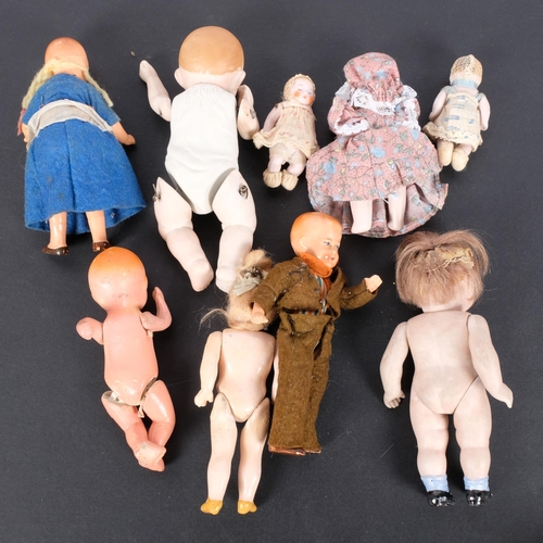 196 - A collection of Vintage miniature porcelain and other dolls with jointed limbs