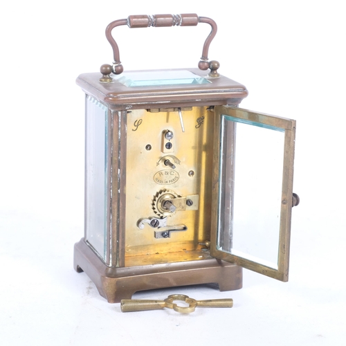 197 - A French brass-cased carriage clock, H11cm not including handle, complete with key, currently in wor... 