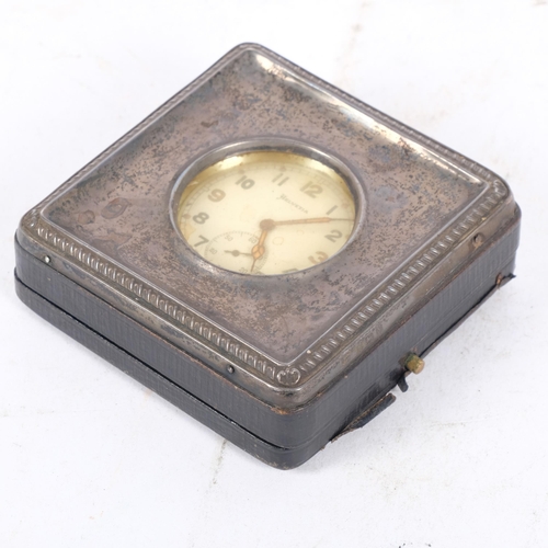 198 - A silver-fronted travelling pocket watch case, early 20th century, together with a Helvetia chrome-c... 