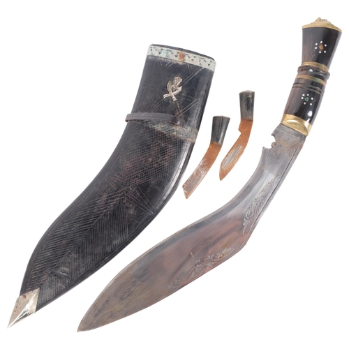 199 - A Nepalese kukri knife and scabbard, brass and horn handle, including 2 small knives