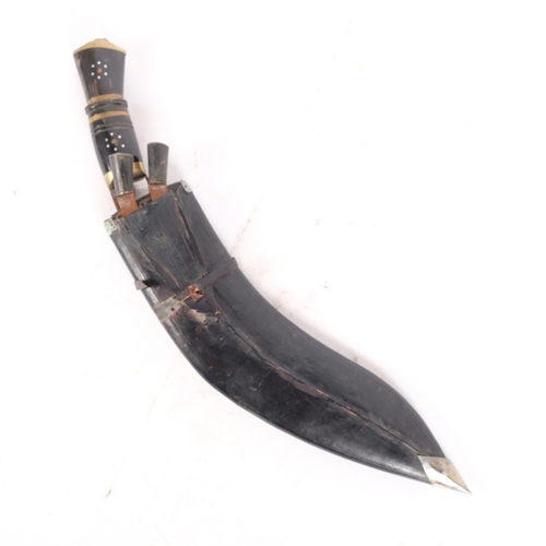 199 - A Nepalese kukri knife and scabbard, brass and horn handle, including 2 small knives