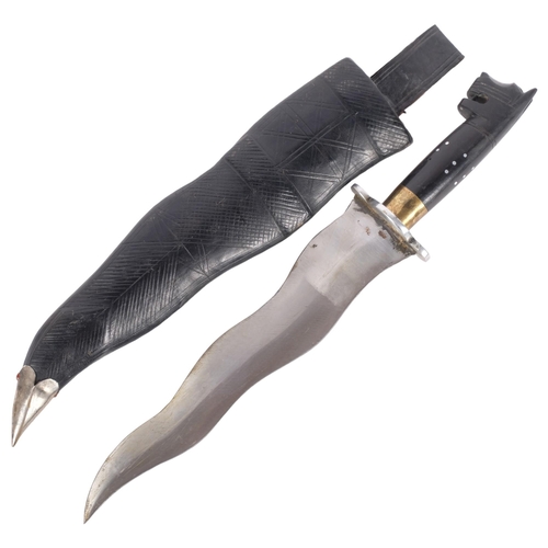 203 - A steel-bladed Kris with carved ebony panther handle, knife length 31.5cm, with leather scabbard