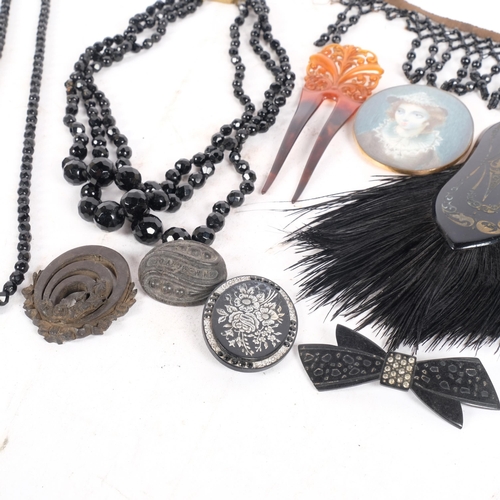 206 - A tray of various jewellery, including a bog oak brooch, a silver inlaid jet brooch, miniature, etc