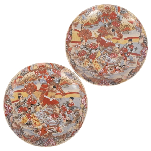 217 - A pair of Japanese white Satsuma chargers, enamelled and hand painted decoration, diameter 37cm