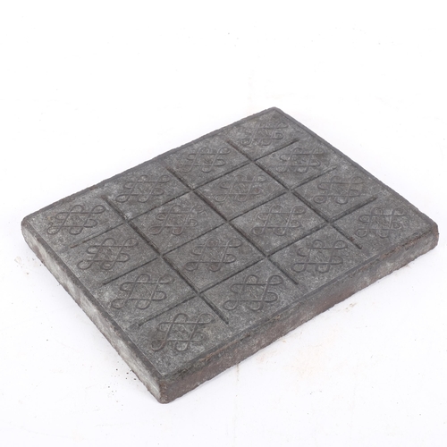 218 - A Chinese tea brick, 25cm x 20cm