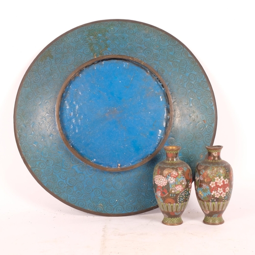 220 - A Chinese enamel plate with crane decoration, diameter 30cm, and a pair of small cloisonne fluted va... 