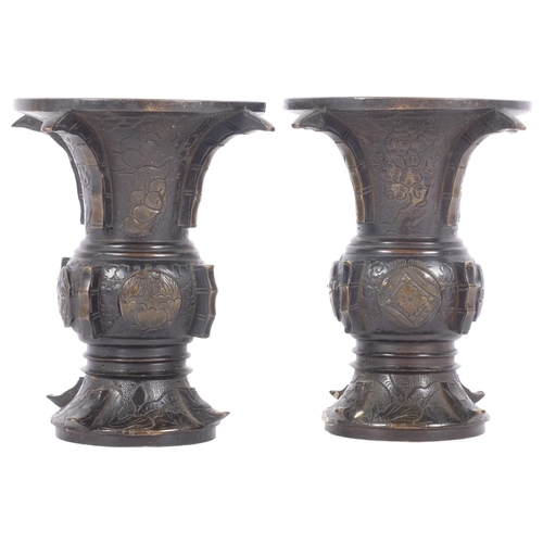 228 - A pair of Japanese temple vases, with raised and engraved decoration, H13cm