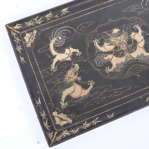 229 - A rectangular black lacquered serving tray, gilded dragon decoration, 53cm x 33cm