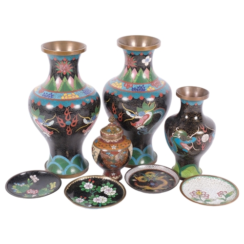 234 - A group of Oriental cloisonne wear, including a pair of black ground vases with dragon decoration, H... 