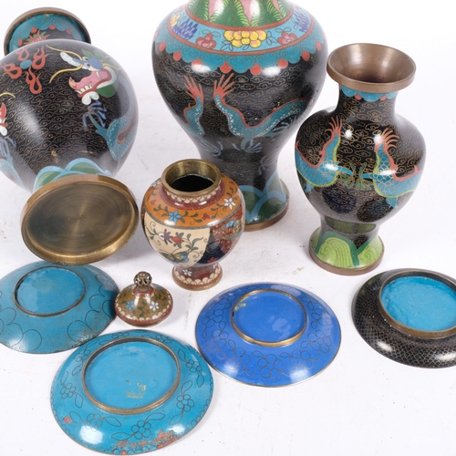 234 - A group of Oriental cloisonne wear, including a pair of black ground vases with dragon decoration, H... 