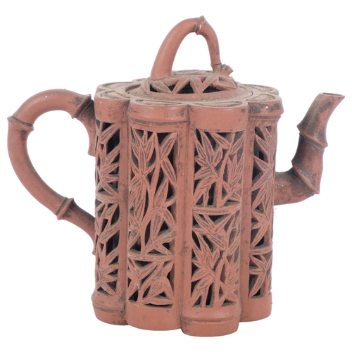 237 - A Chinese Yixing red stoneware reticulated 