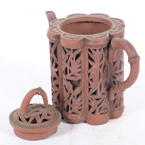 237 - A Chinese Yixing red stoneware reticulated 