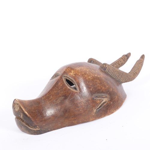 24 - An African Bobo Kobe carved wood antelope mask, L51cm